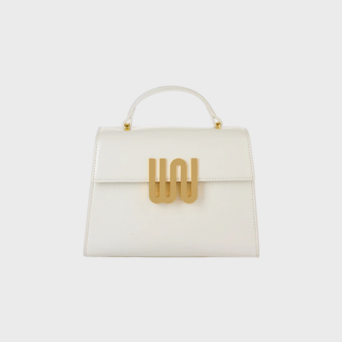 Bronzite Nougat top handle bag in creamy nougat leather with embossed crocodile texture