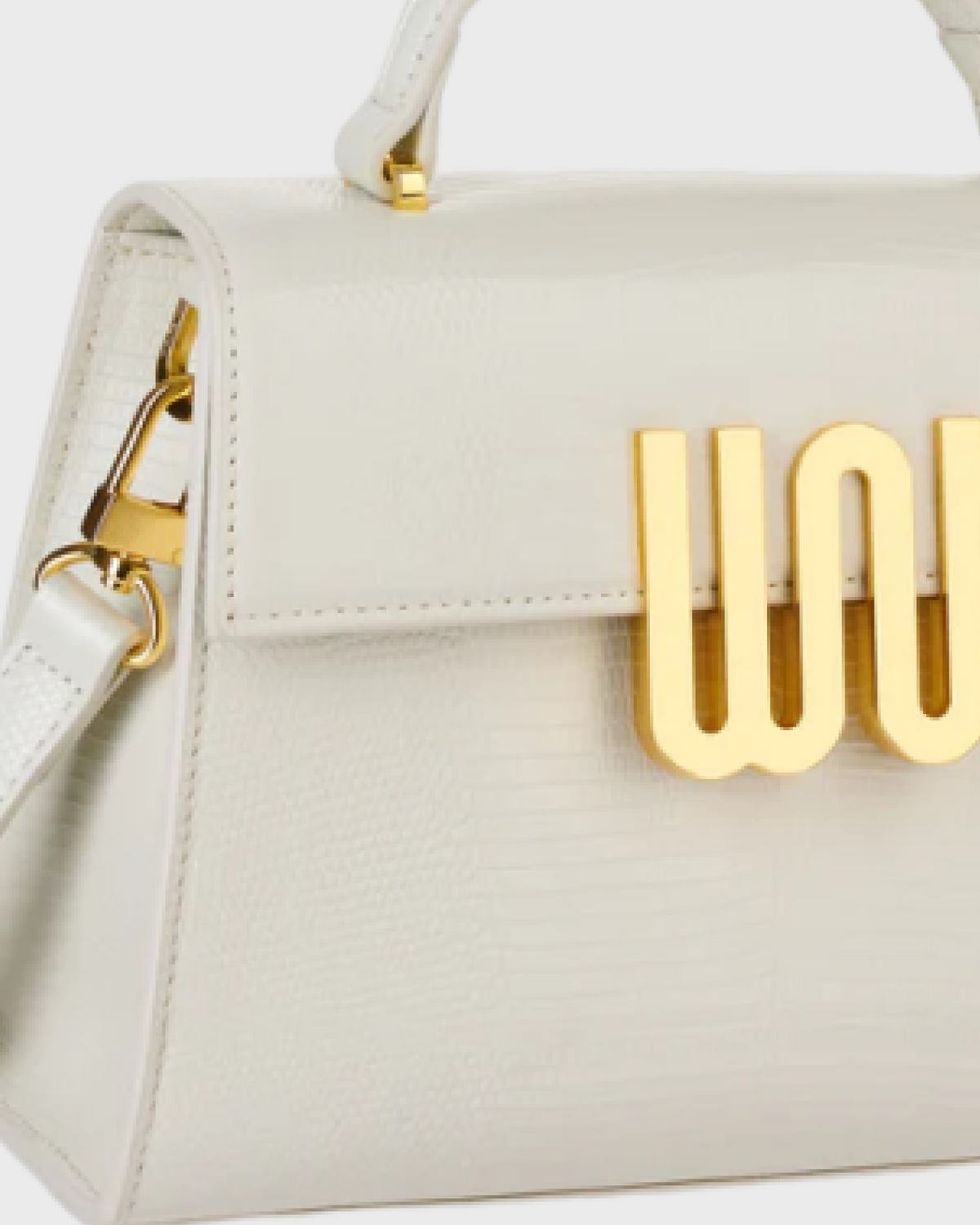 Bronzite Nougat gold WN logo and strap hardware detail