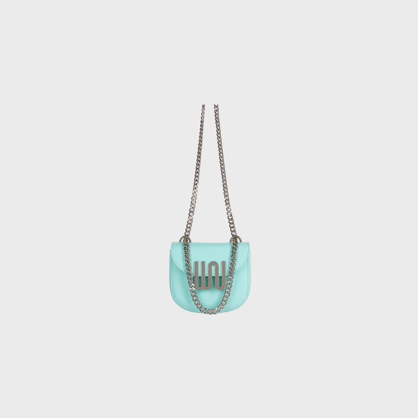 Turquoise handbag with a chain strap on a light gray background