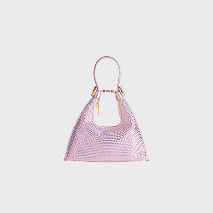 Pink woven handbag on a light gray background