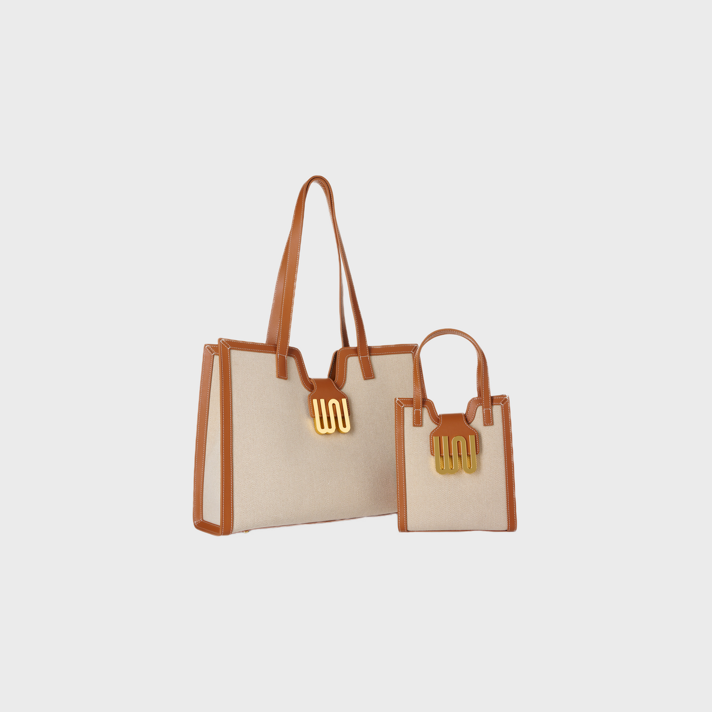 Beige tote bag with brown handles on a light gray background