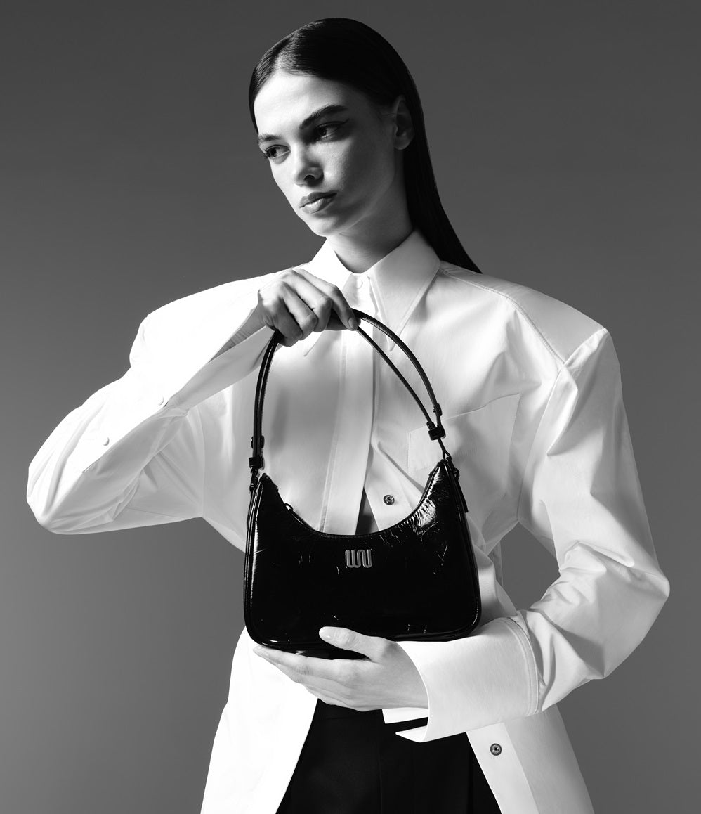 Onyx Noir hobo bag in glossy black patent leather