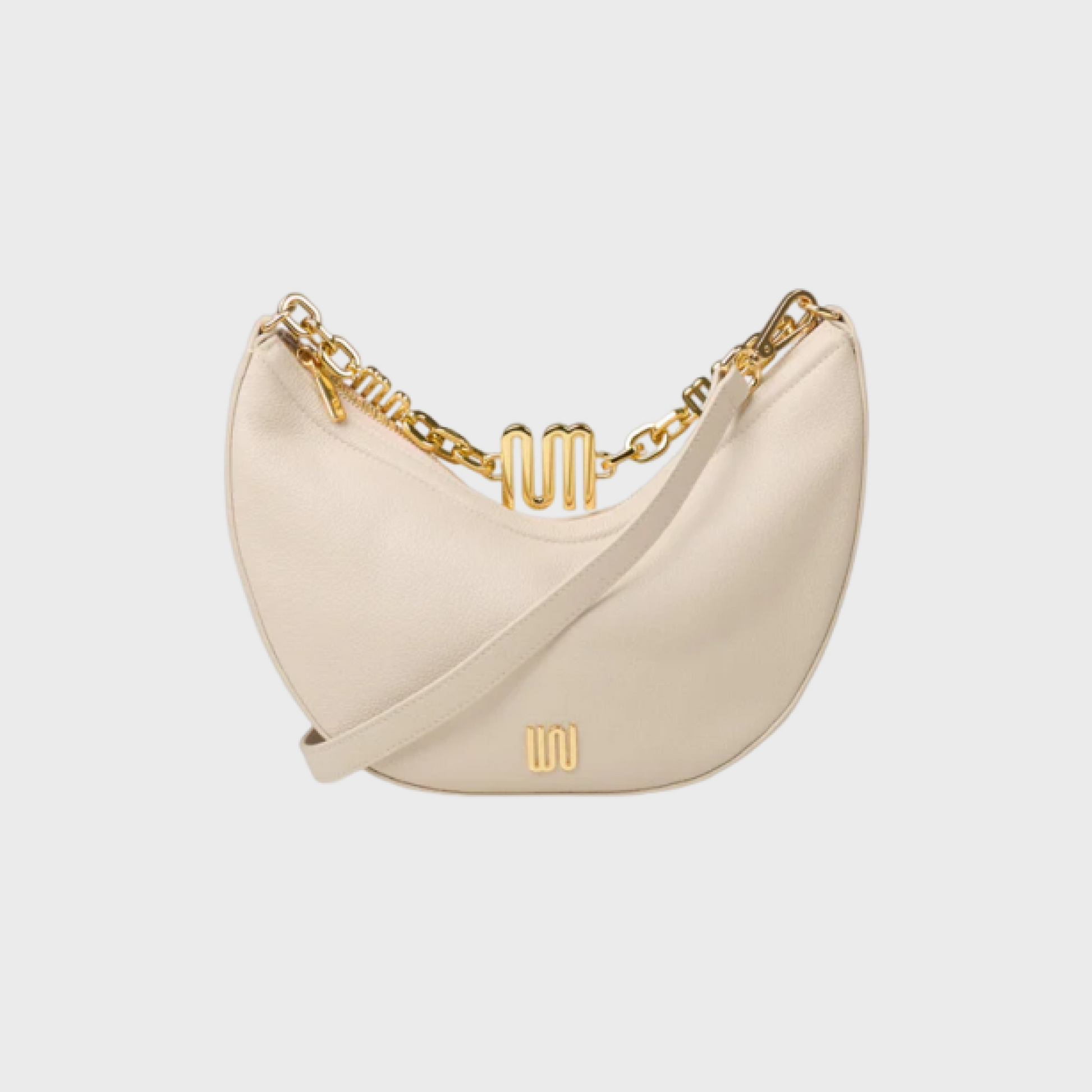 Beige handbag with gold chain detail on a light gray background