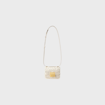 Pyrite Nougat studded mini bag in Togo leather