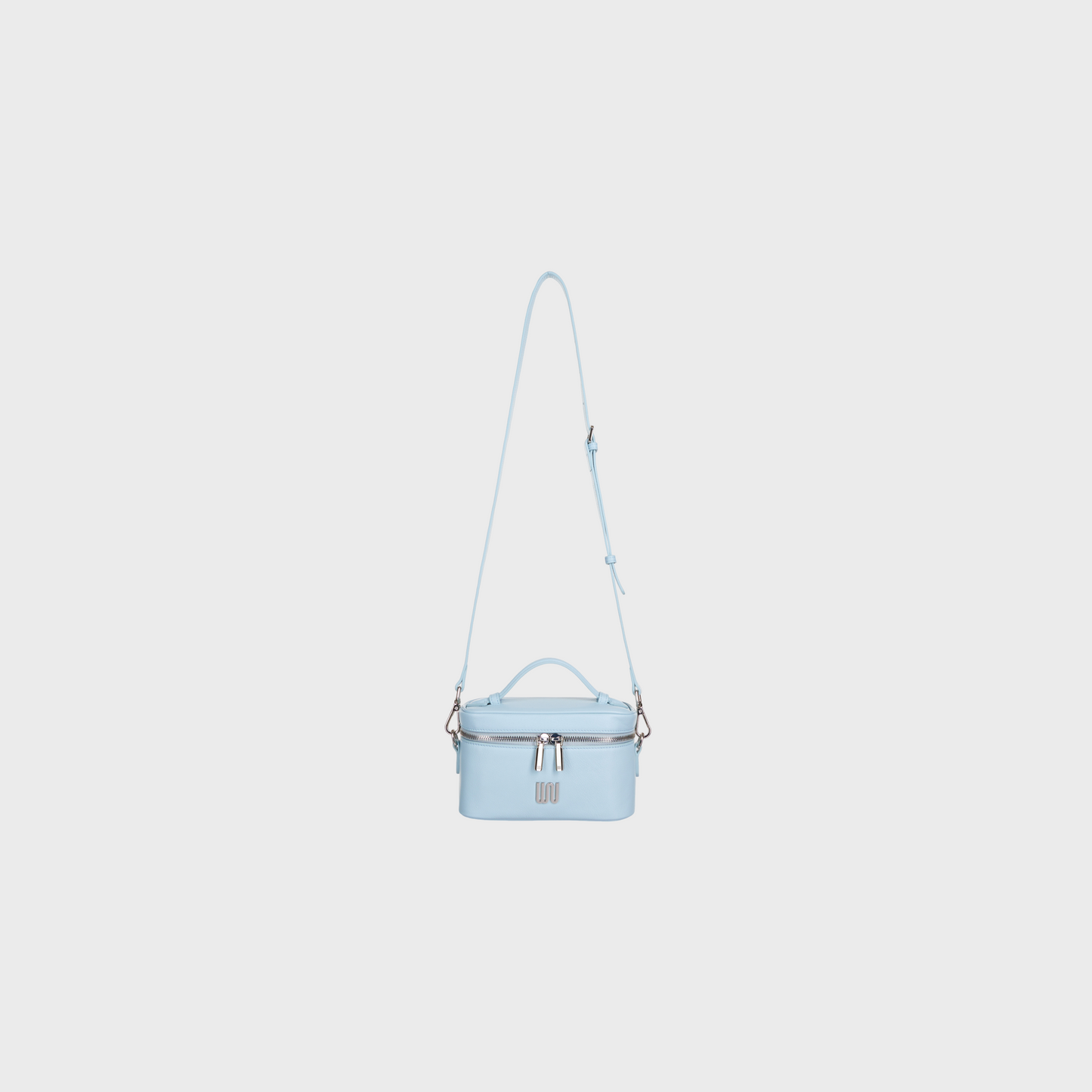 Light blue handbag with a strap on a white background