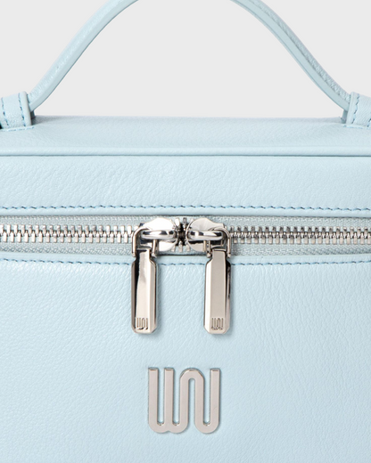 Quartz Azure silver WN logo and zip pulls close-up