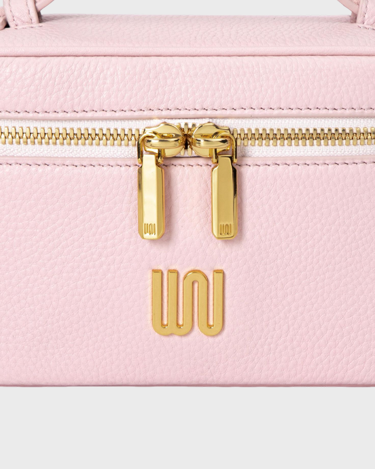 White Noise The Label Quartz Blush Chic, zip pull and WN logo close-up