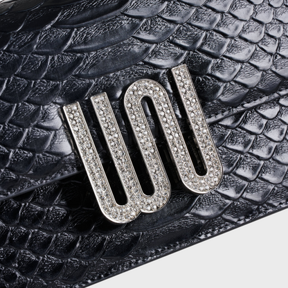 Selenite Noir bag in Togo leather with snake detail