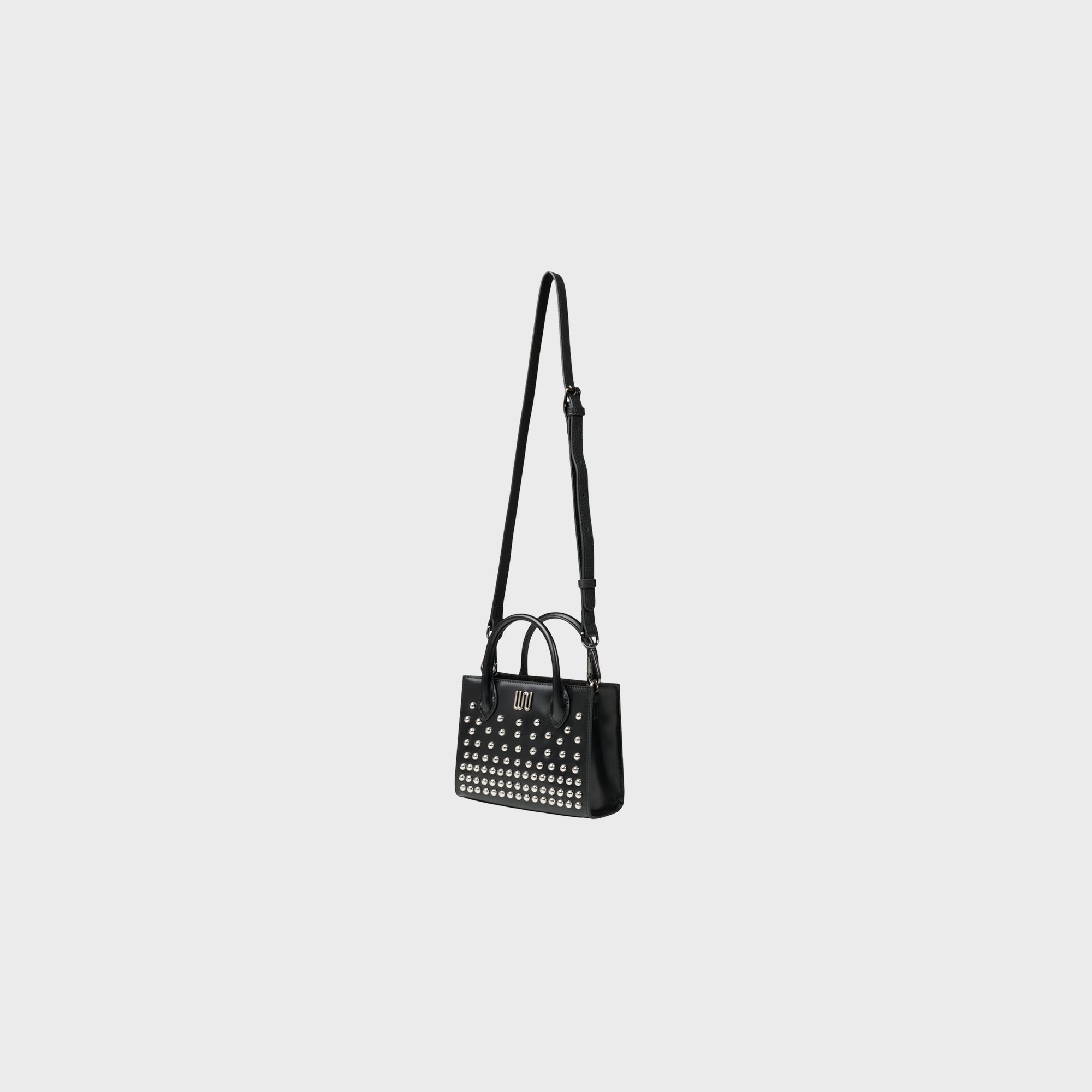 Soladite Noir top handle bag in matte black leather