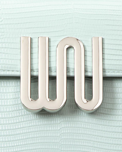 White Noise The Label Bronzite Lagoon, gunmetal WN logo hardware close-up on lizard-embossed leather