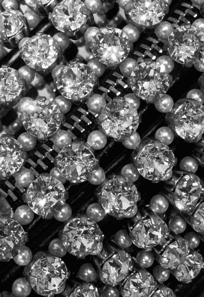 Swarovski crystals and pearls on a White Noise The Label piece, close up